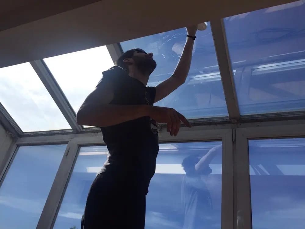 Non-reflective solar control window film on a window — 14